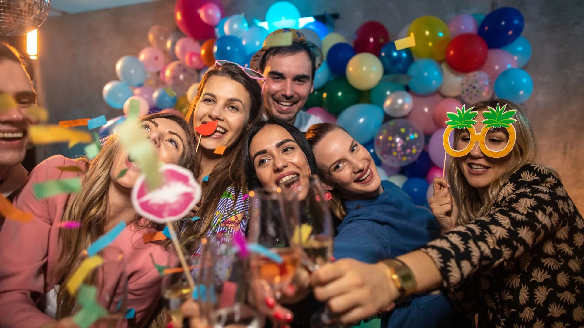 Friends celebrating and sharing photos at a birthday party