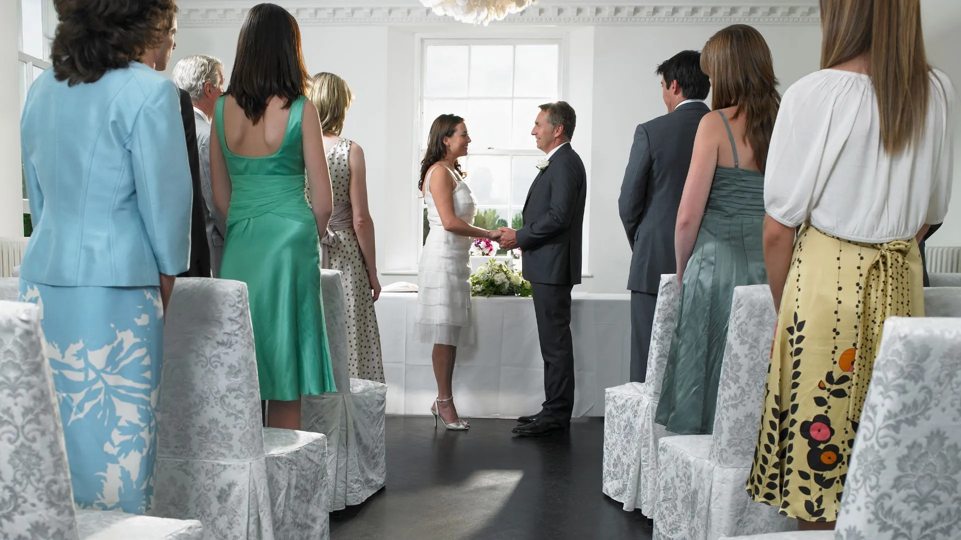Wedding guests sharing photos on their phones